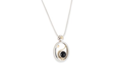 Lot 157 - A SILVER AND ONYX SET ABSTRACT PENDANT BY...