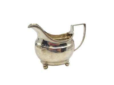 Lot 525 - A GEORGE III SILVER MILK JUG, of plain loaf of...