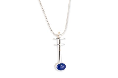 Lot 158 - A LAPIS LAZULI SET STERLING SILVER PENDANT BY...