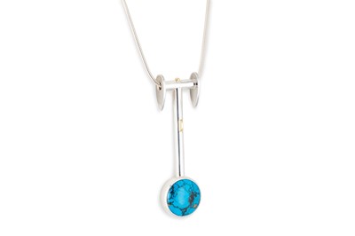 Lot 159 - A TURQUOISE SET STERLING SILVER PENDANT BY...