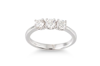 Lot 153 - A DIAMOND THREE STONE RING, the brilliant cut...