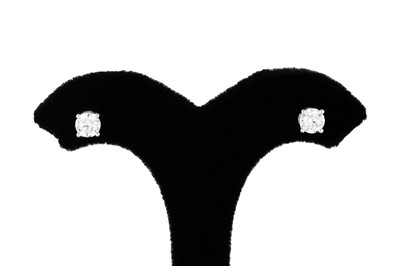 Lot 180 - A PAIR OF DIAMOND STUD EARRINGS, the round...