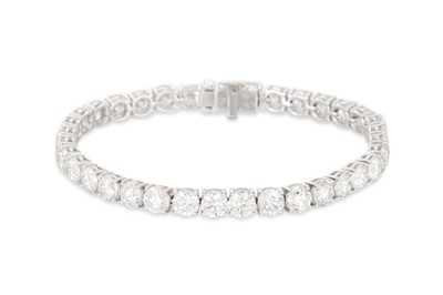 Lot 327 - A DIAMOND LINE BRACELET, the brilliant cut...