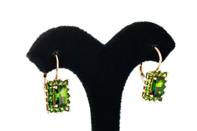 Lot 262 - A PAIR OF PERIDOT CLUSTER EARRINGS, mounted in...