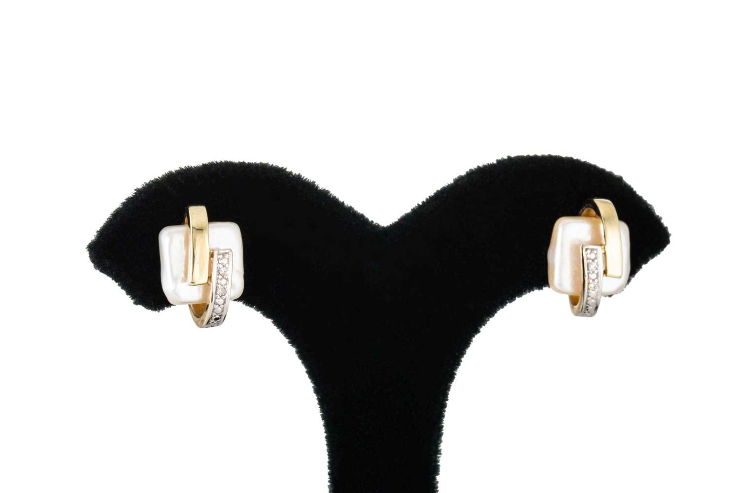 Lot 148 - A PAIR OF MOTHER-OF-PEARL AND DIAMOND STUD...
