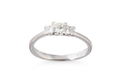 Lot 98 - A DIAMOND THREE STONE RING, the princess cut...