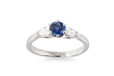 Lot 101 - A SAPPHIRE AND DIAMOND SET THREE STONE RING,...