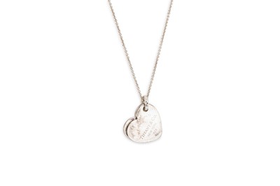Lot 16 - A DOUBLE HEART PENDANT, by Tiffany & Co., the...