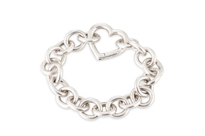 Lot 19 - A STERLING SILVER BRACELET, with heart work...