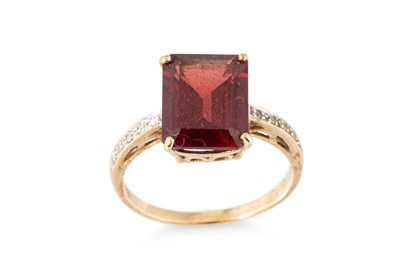 Lot 45 - A GARNET AND DIAMOND SET RING, the central...