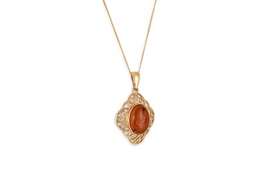 Lot 341 - A 9CT GOLD AND AMBER PENDANT, openwork design,...