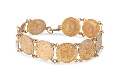 Lot 514 - A VINATGE SILVER GILT COIN BRACELET, bolt clasp