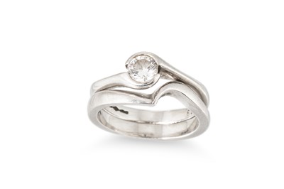Lot 334 - A CONTEMPORARY DIAMOND SOLITAIRE RING, in...