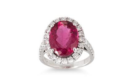Lot 277 - A PINK TOURMALINE AND DIAMOND RING, the oval...