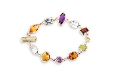 Lot 280 - A GEM-SET BRACELET, the vari cut stones collet...