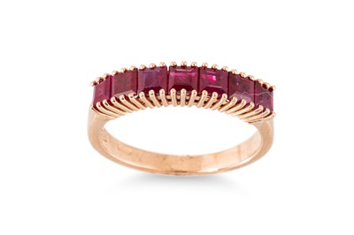 Lot 282 - A RUBY HALF ETERNITY RING, the baguette set...