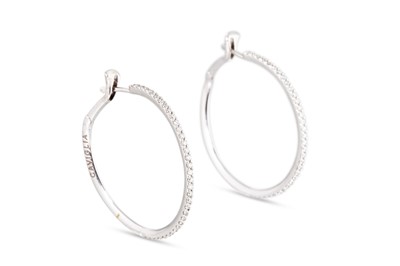Lot 308 - A PAIR OF DIAMOND HOOP EARRINGS, mounted in...