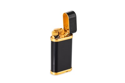 Lot 90 - A CARTIER BLACK ENAMEL LIGHTER, stamped...