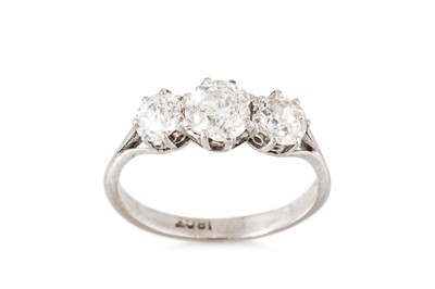 Lot 97 - A THREE STONE DIAMOND RING, the three round...