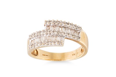 Lot 100 - A DIAMOND CLUSTER RING, the baguette and round...