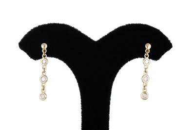 Lot 332 - A PAIR OF DIAMOND DROP EARRINGS, the bezel set...