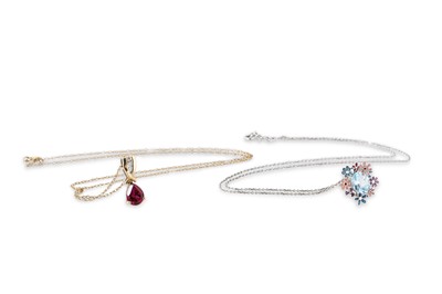 Lot 235 - A TOPAZ AND ENAMEL SET PENDANT, the central...