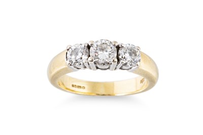 Lot 236 - A DIAMOND THREE STONE RING, the round...