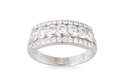 Lot 282 - A THREE-ROWED DIAMOND RING, the brilliant cut...