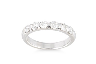 Lot 283 - A SIX STONE DIAMOND BAND RING, the brilliant...