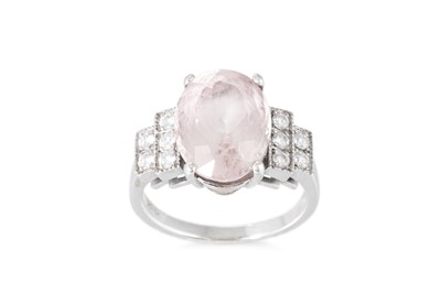 Lot 284 - A MORGANITE AND DIAMOND RING, the oval...