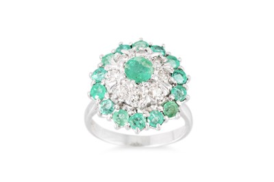 Lot 286 - AN EMERALD AND DIAMOND CLUSTER RING, mounted...