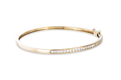 Lot 97 - A 9CT YELLOW GOLD BANGLE, hinge clasp, set...