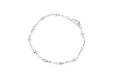 Lot 60 - A DIAMOND SET CHAIN BRACELET, the round...