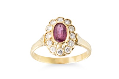 Lot 175 - A RUBY AND DIAMOND CLUSTER RING, the oval...