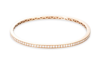 Lot 178 - A DIAMOND SET BANGLE, set with brilliant cut...