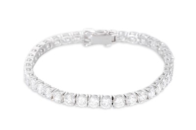 Lot 346 - A DIAMOND LINE BRACELET, the brilliant cut...