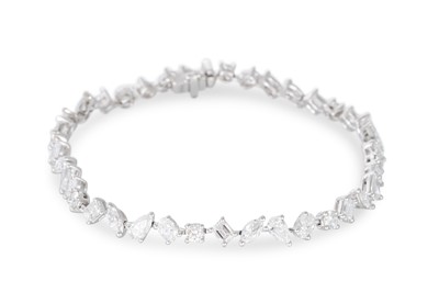 Lot 347 - A MIXED CUT DIAMOND LINE BRACELET, set with...