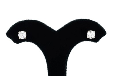 Lot 6 - A PAIR OF DIAMOND STUD EARRINGS, the round...