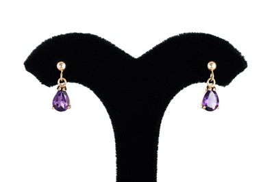 Lot 10 - A PAIR OF AMETHYST DROP EARRINGS, the pear cut...
