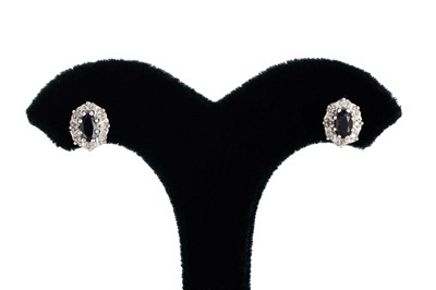 Lot 11 - A PAIR OF DIAMOND AND SAPPHIRE EARRINGS, the...