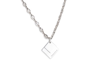 Lot 87 - A TIFFANY & CO PENDANT AND CHAIN, pendant of...