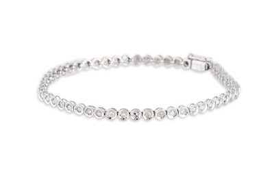 Lot 102 - A DIAMOND LINE BRACELET, the round cut diamond,...