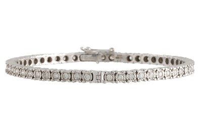 Lot 356 - A DIAMOND SET HINGED BRACELET, the circular...