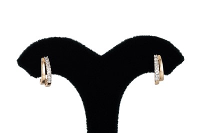 Lot 105 - A PAIR OF DIAMOND HOOP EARRINGS, mounted in...