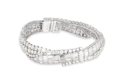 Lot 114 - AN IMPRESSIVE DIAMOND BANGLE, the round and...