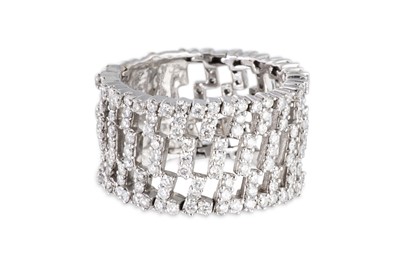 Lot 145 - A DIAMOND RING, of flexible openwork form,...