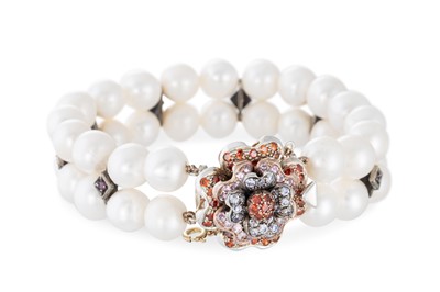 Lot 155 - A TWO STRANDED PEARL BRACELET, stone set...