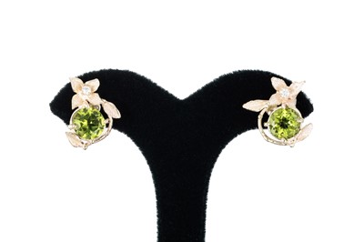 Lot 274 - A PAIR OF PERIDOT AND DIAMOND EARRINGS, of...