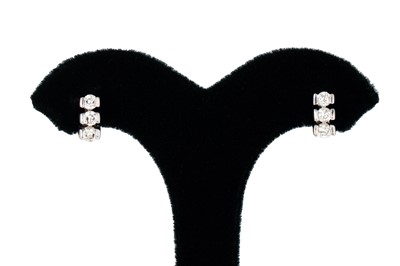 Lot 201 - A PAIR OF DIAMOND EARRINGS, the triple set...