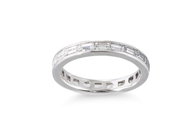 Lot 131 - A DIAMOND BAGUETTE CUT ETERNITY RING, mounted...